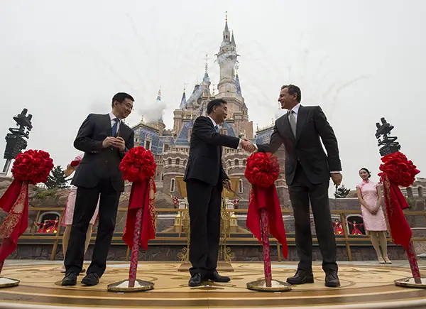 SHANGHAI (June 16, 2016) – Thousands of invited guests celebrated the Grand Opening of Shanghai Disney Resort today with the help of a flood of Shanghai Disney cast members and Disney character friends. Bob Iger, chairman and CEO of The Walt Disney Company (right) joined Chinese CPC Politburo members Wang Yang, State Council Vice Premier (middle), and Han Zheng, Party Secretary of Shanghai (left), to officially open the resort’s new theme park, Shanghai Disneyland, at the iconic Enchanted Storybook Castle. At the dedication ceremony,six performers wearing enormous, colorful flags represented the six lands of Shanghai Disneyland: Adventure Isle, Gardens of Imagination, Fantasyland, Mickey Avenue, Tomorrowland and Treasure Cove. Shanghai Disney Resort is a world-class family entertainment destination, imagined and created especially for the people of China. The resort consists of Shanghai Disneyland, a theme park with magical experiences for guests of all ages; two richly themed hotels; Disneytown, an international shopping, dining and entertainment district; and Wishing Star Park, a recreational area with peaceful gardens and a glittering lake. Shanghai Disney Resort is a joint venture between The Walt Disney Company and Shanghai Shendi Group comprised of two owner companies (Shanghai International Theme Park Company Limited and Shanghai International Theme Park Associated Facilities Company Limited) and a management company (Shanghai International Theme Park and Resort Management Company Limited).   (Matt Stroshane, photographer)