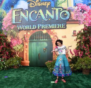 FIRST LOOK: Mirabel character from Disney's ENCANTO makes live appearance  at Hollywood premiere