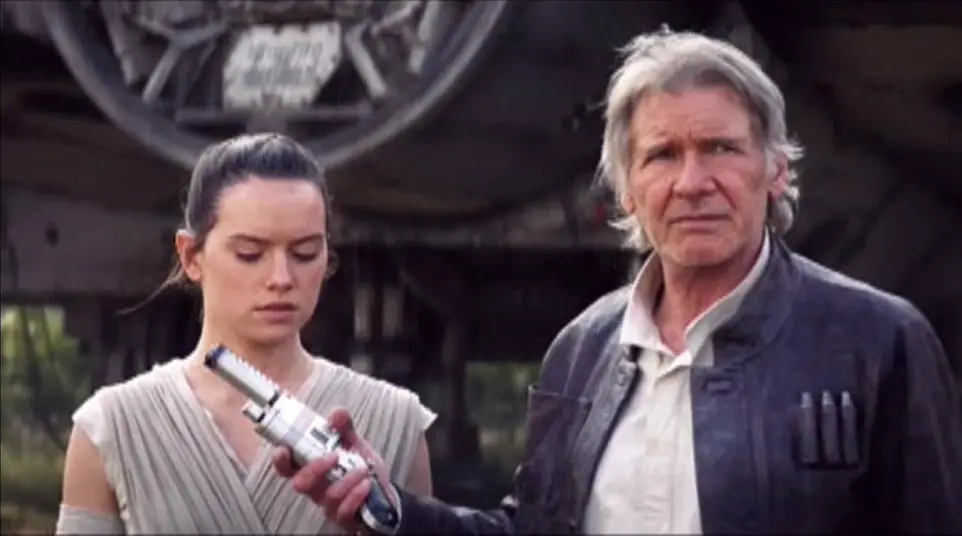 Han Solo Hands Rey a Weapon - Star Wars: The Force Awakens