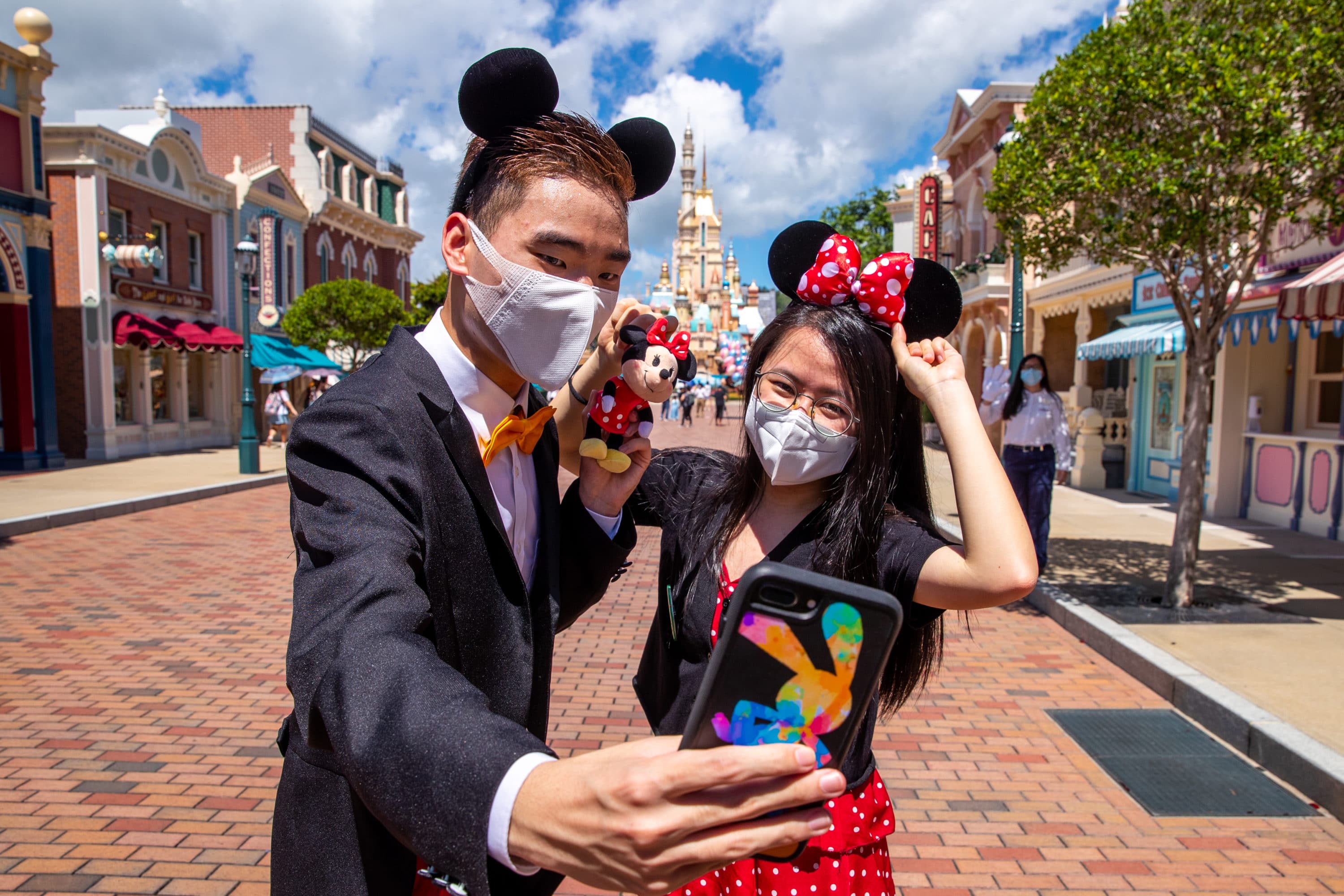 Guests enjoy the reopening of Hong Kong Disneyland on its reopening day. 