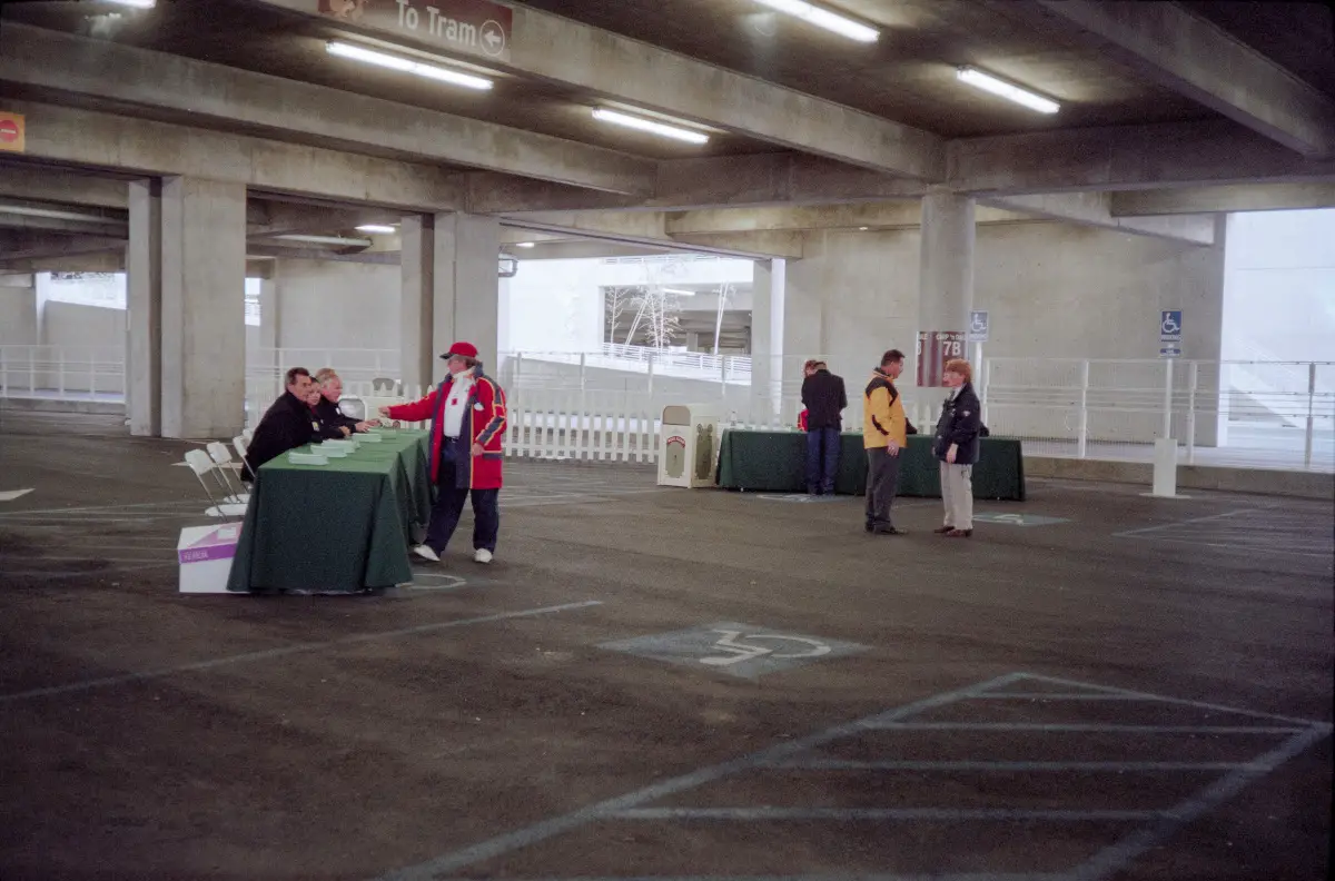 Inside the structure, cast members prepare to process opening day guests