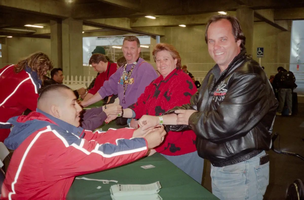 Steven W. Smith (right) receives the first wristband