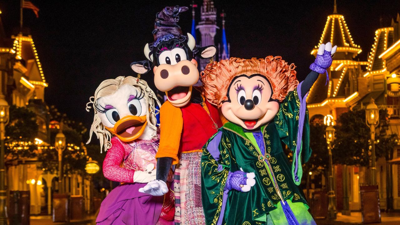 Minnie, Daisy, and Clarabelle Dressed as the Sanderson Sisters Heading to Mickey’s Not-So-Scary Halloween Party