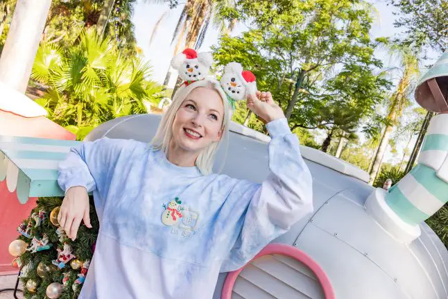 Model wearing snowman ear headband