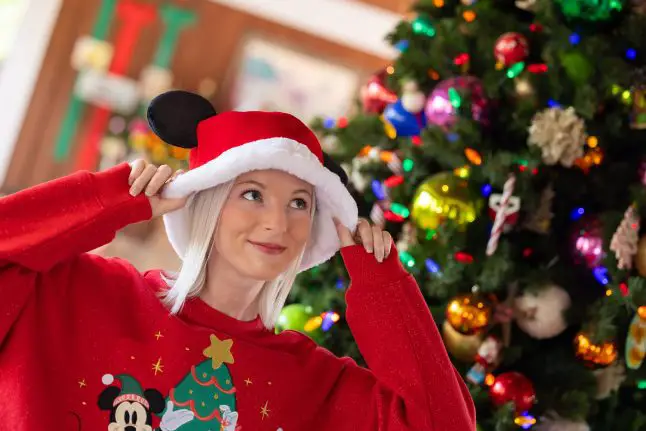 Model wearing Santa Mickey bucket hat 