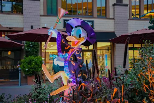 Donald Duck smiles as he celebrates the Halloween season in Downtown Disney District.