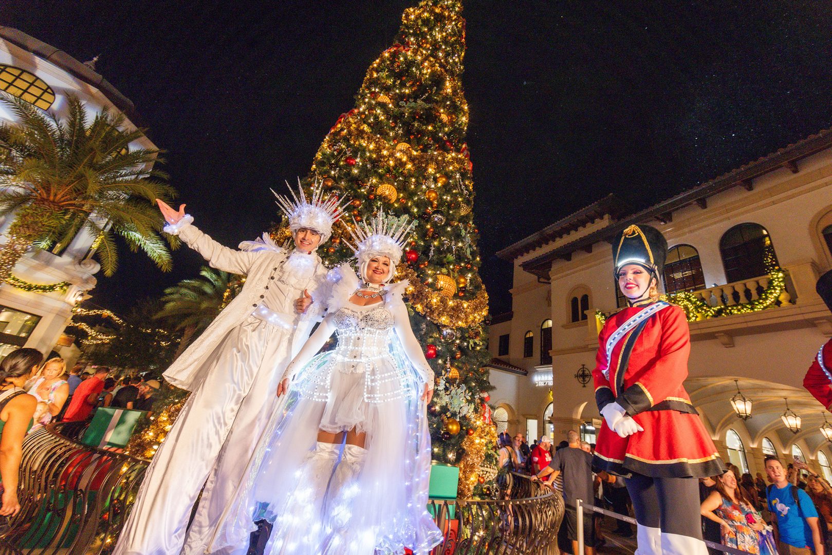 Holiday stilt performers at Disney Springs