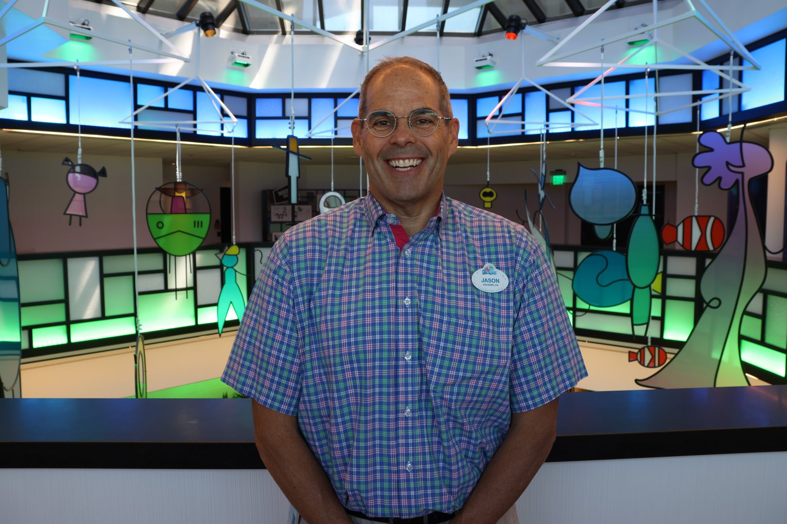 Jason Alexander poses inside Pixar Place Hotel.