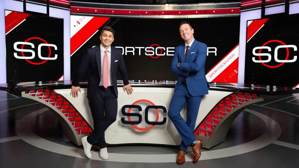 Gary Striewski and Randy Scott stand at the "SportsCenter" set.