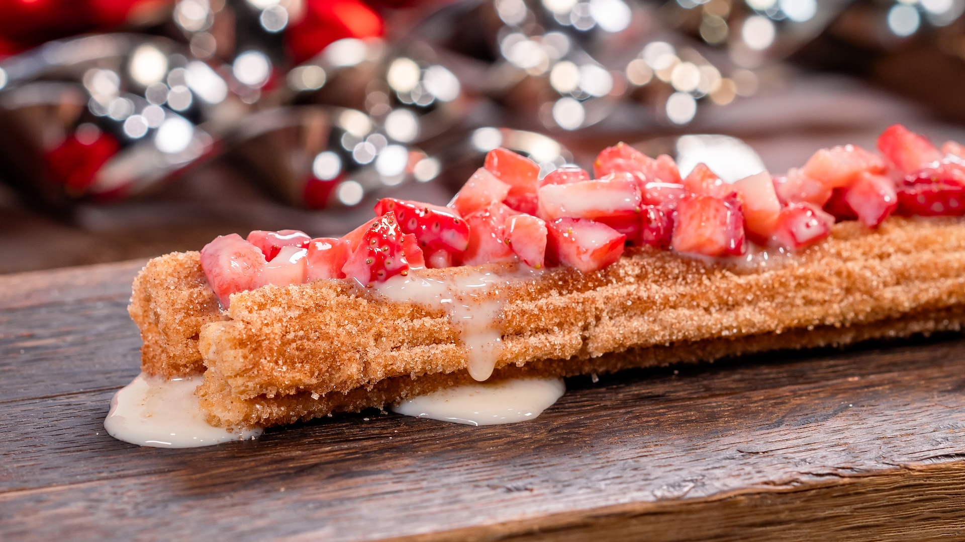 Fresas con Crema Churro: Classic churro topped with fresh strawberries and condensed milk
