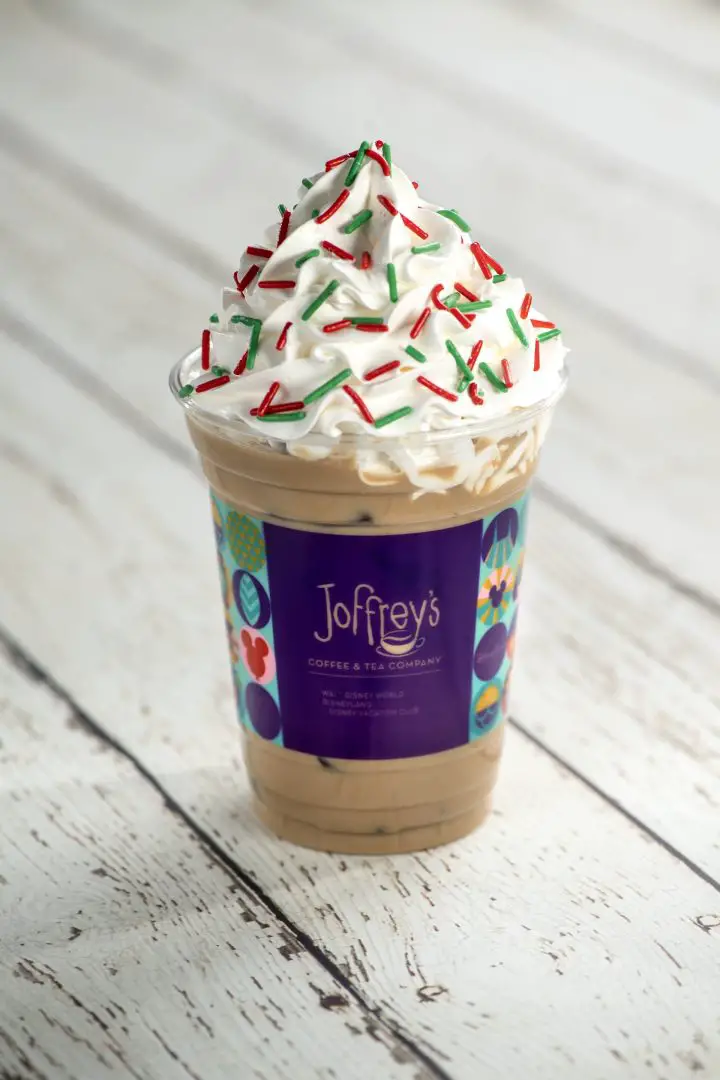 Holiday Cookie Latte: Espresso, caramel sauce, almond syrup, and choice of milk topped with whipped cream and merry sugar sprinkles (Non-alcoholic) (New) (Spirited version available with Baileys Original Irish Cream Liqueur)