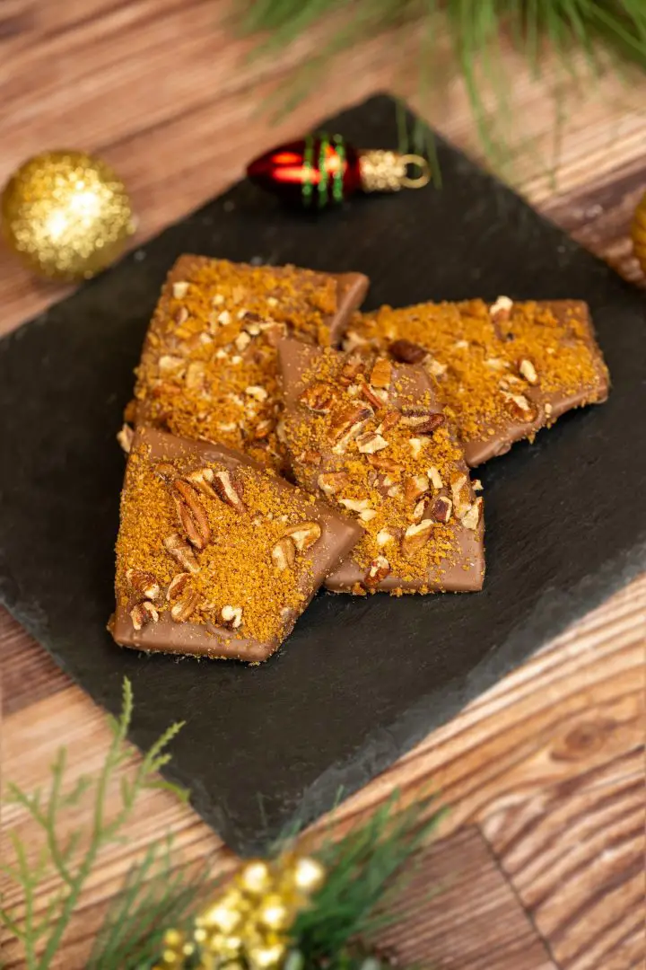 Gingerbread-Pecan Toffee: Spiced toffee enrobed with milk chocolate and encrusted with toasted pecans and gingerbread crumbs 