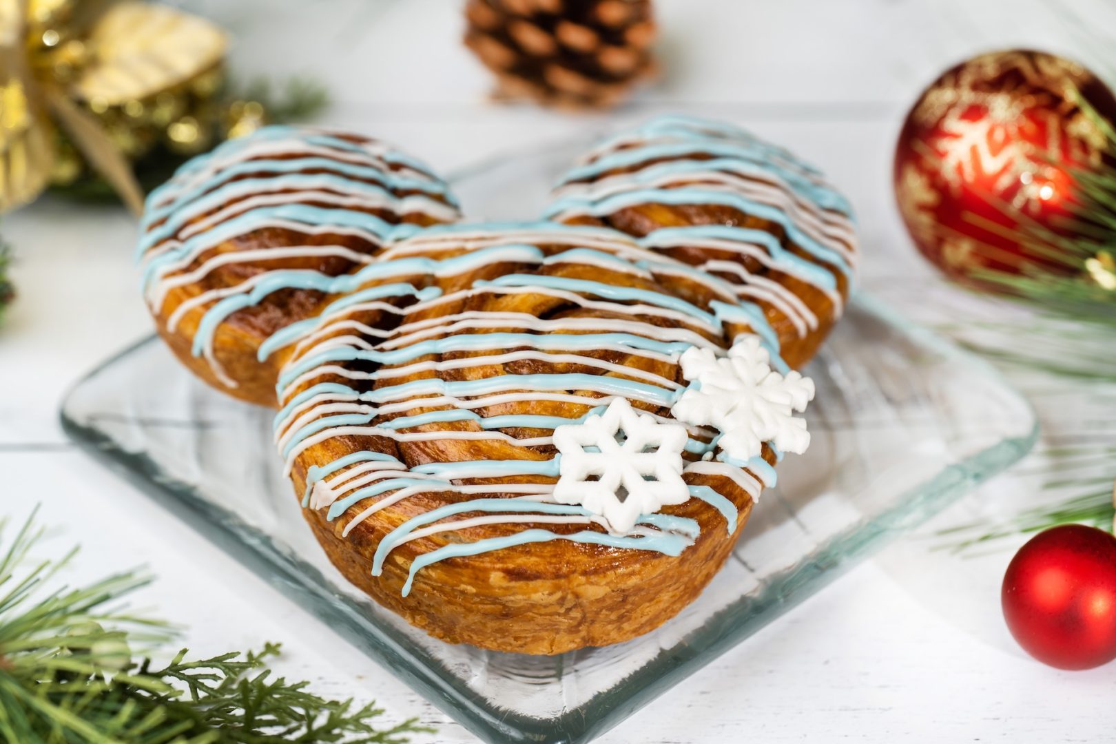 Snowflake Cinnamon Roll: Fondant icing with sugar snowflake décor
