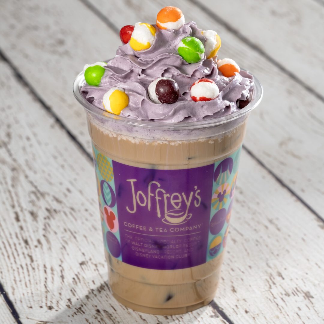 Pop Art Latte: Espresso with choice of milk and vanilla syrup topped with lavender whipped cream and SKITTLES POP’d Original Freeze Dried Candy (Non-alcoholic beverage) (Spirited version available with Baileys Original Irish Cream Liqueur) (New)