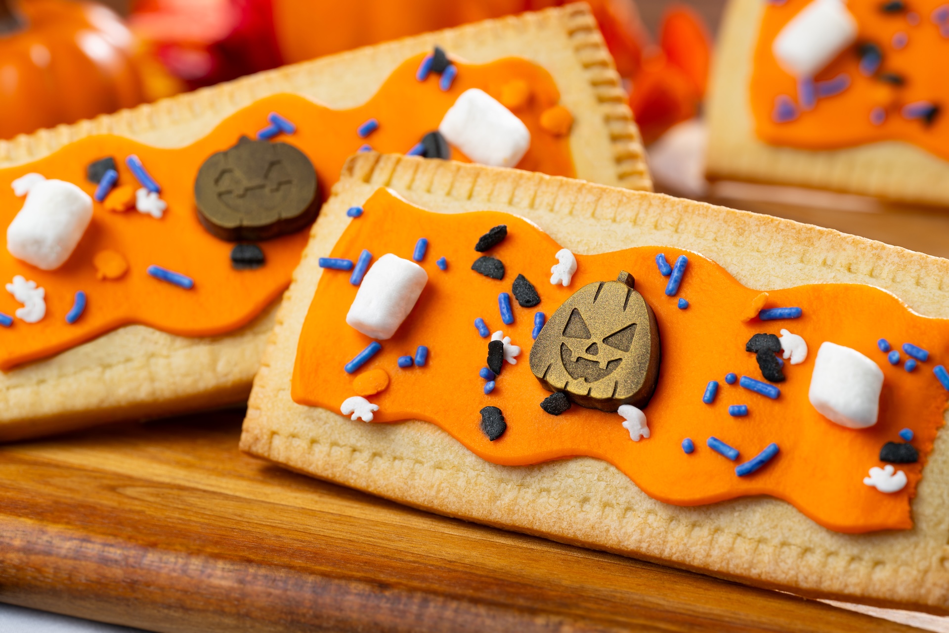 Pumpkin Lunch Box Tart: Pumpkin pie-filled pastry tart with marshmallow fondant, Halloween sprinkles,  marshmallows, and chocolate jack-o